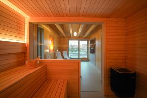 a sauna with a window and a bench in it at Ferienhaus Weitsicht in Großschönau