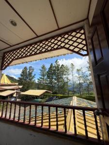 a view from the window of a balcony at Rose Cabin Kundasang in Ranau
