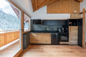 Køkken eller tekøkken på Orchidea Suite Apartments