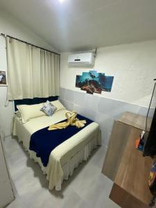 En eller flere senge i et værelse på Flat Silveira