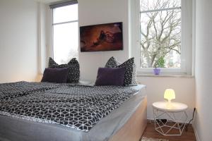 a bedroom with a bed and a window at Pension963 in Crimmitschau