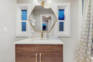 a bathroom with a sink and a mirror at Saltwind Shores in Moclips +11 photos