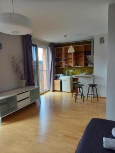 a room with a kitchen and a living room at Studio Deluxe in Tallinn