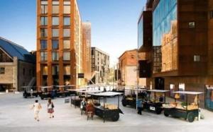 a group of people walking in a city with buildings at Studio Deluxe in Tallinn +2 photos