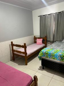 Giường trong phòng chung tại CASA TEMPORADA PRADO-BA +12 ảnh