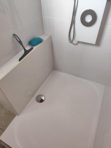 a white bathroom with a shower with a sink at Gîte menthe à l'eau in Ciadoux +39 photos