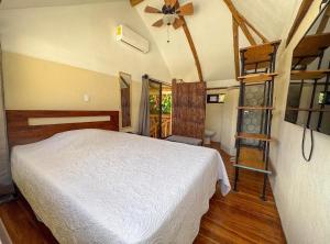 Giường trong phòng chung tại Silencio Verde