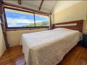 Giường trong phòng chung tại Silencio Verde