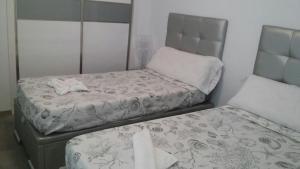 Posteľ alebo postele v izbe v ubytovaní Ciudad Blanca Apartment