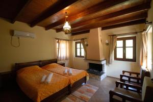 En eller flere senge i et værelse på Piges Hotel