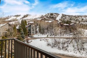 a winter view from the balcony of a condo at Bear Claw 402 - Premier Ski-in Ski-out & Winter Shuttle! Renovated 2025! in Steamboat Springs