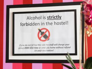 a sign with a picture of a woman on it at Stockholm Hostel in Stockholm