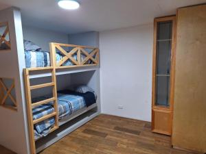 a room with two bunk beds and a closet at Modern Industrial Artsy Apt Remodel Secure in Matamoros