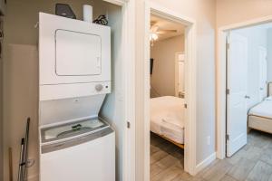 a small room with a room with a bed and a mirror at Serene 2BR Home with Premium Beds in Glendale +153 photos