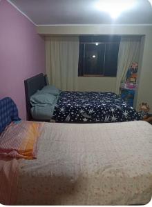 En eller flere senge i et værelse på Habitación Los Solises