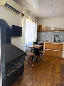 TV a/nebo společenská místnost v ubytování Casa en alquiler El Detalle Punta Negra