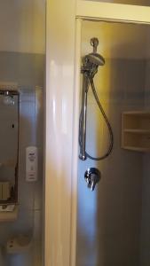 a shower in the corner of a bathroom at Hotel Villa Etrusca in Marina di Campo +65 photos