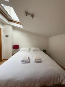 En eller flere senge i et værelse på Cozy Studio & Patio in Funchal