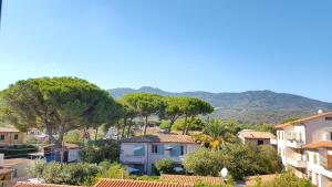 a view of a city with trees and buildings at Hotel Villa Etrusca in Marina di Campo