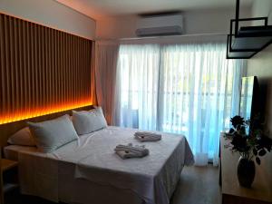 En eller flere senge i et værelse på Araça flat 308 - Lateral Vista Jardim + 28 billeder