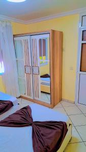 a bedroom with two beds and a large mirror at le riffe in Nador