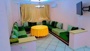 a living room with a couch and a table at le riffe in Nador