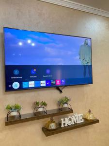 a flat screen tv hanging on a wall at le riffe in Nador +6 photos
