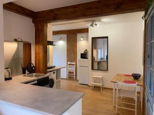 a kitchen with a table and a counter top at Stay with a View in Gdynia