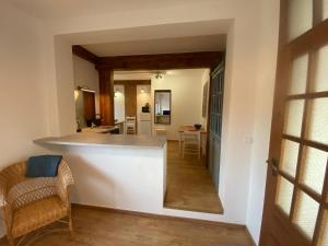 a kitchen and living room with a counter and a counter top at Stay with a View in Gdynia