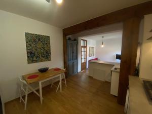 a kitchen with a table and a dining room at Stay with a View in Gdynia