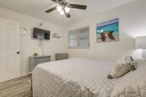 a bedroom with a bed and a ceiling fan at Walk to Shops and Dining Downtown Stuart Home! in Stuart