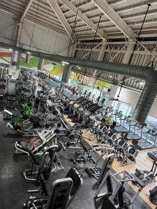 a large gym filled with lots of exercise equipment at La mejor ubicación Condomar 133 in Puerto Vallarta