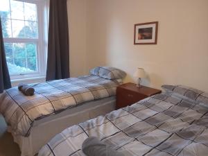 En eller flere senge i et værelse på lake District cottage