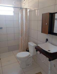 Phòng tắm tại Casa praia picarras centro +9 ảnh