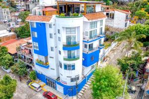 an overhead view of a white and blue building at Casa Chevere in Puerto Vallarta +149 photos
