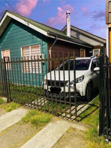 a car parked in front of a house at Casa Lepeley Colimilla in Frutillar