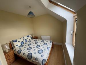 En eller flere senge i et værelse på Montbretia - Ballinskelligs