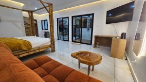 TV a/nebo společenská místnost v ubytování Ayooka Beach Residence Grand Bassam