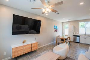 a living room with a ceiling fan and a table at Serene 2BR Home with Premium Beds in Glendale