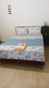 En eller flere senge i et værelse på Cantinho de casa