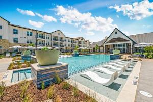 an image of a swimming pool at a hotel at Landing Apartments - Atlas Bluewood in Celina
