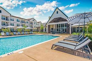 an image of a pool at a hotel at Landing Apartments - Atlas Bluewood in Celina