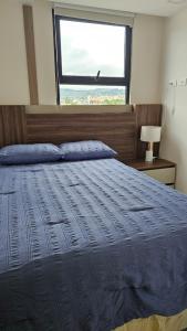 En eller flere senge i et værelse på Lirios Miraflores Apartment