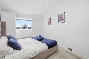 En eller flere senge i et værelse på Central Apartment - 16 Mins to London