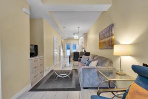 a living room with a couch and a tv at banff woods lodge in Canmore
