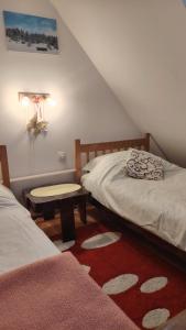 En eller flere senge i et værelse på Apartman Joca Zlatibor