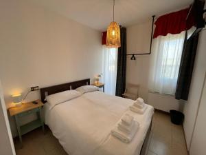 Postel nebo postele na pokoji v ubytování Albergaria