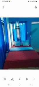 En eller flere senge i et værelse på Apartamentos La Mina