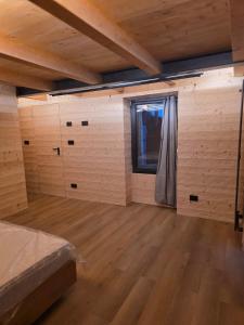 a large room with a bed and a window at Muranche Loft S1 in Valtournenche +18 photos