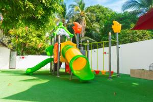 a playground with a slide in a park at ZABDI COVEÑAS in Coveñas